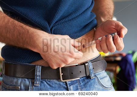 Male Diabetic Injecting Themselves With Insulin