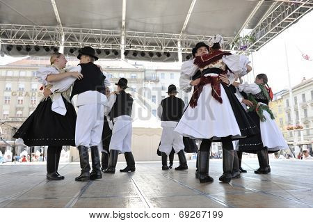 ZAGREB, CROATIA - JULY 19: Members of folk group Seljacka sloga from Donja Dubrava, Croatia during the 48th International Folklore Festival in center of Zagreb, Croatia on July 19, 2014