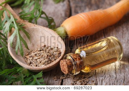 Oil Of Carrot Seeds In A Glass Bottle Closeup Top View