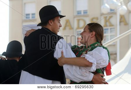 ZAGREB, CROATIA - JULY 19: Members of folk group Seljacka sloga from Donja Dubrava, Croatia during the 48th International Folklore Festival in center of Zagreb, Croatia on July 19, 2014