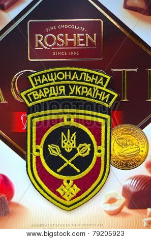 Kiev,Ukraine.Dec 20.Illustrative editorial.Chevron of Ukrainian National Guard.With logo Roshen Inc. Trademark Roshen is property of ukrainian president Poroshenko.At December 20,2014 in Kiev,Ukraine 