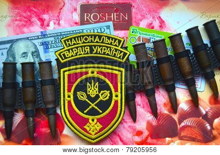 Kiev,Ukraine.Dec 20.Illustrative editorial.Chevron of Ukrainian National Guard.With logo Roshen Inc. Trademark Roshen is property of ukrainian president Poroshenko.At December 20,2014 in Kiev,Ukraine 