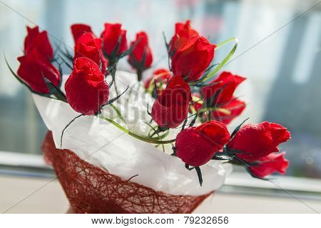 gift for the holiday bouquet of red roses and chocolates