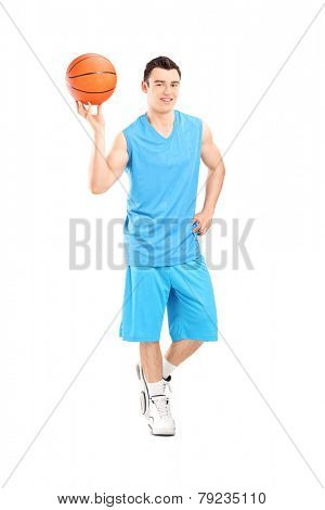 Full length portrait of a basketball player posing with a ball isolated on white background