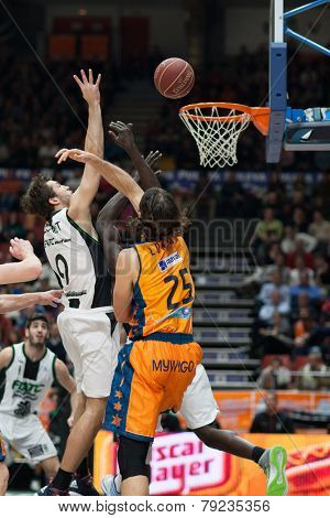 VALENCIA, SPAIN - DECEMBER 30: Llovet (9) and Loncar (25) during Spanish League match between Valencia Basket Club and Juventut at Fonteta Stadium on December 30, 2014 in Valencia, Spain