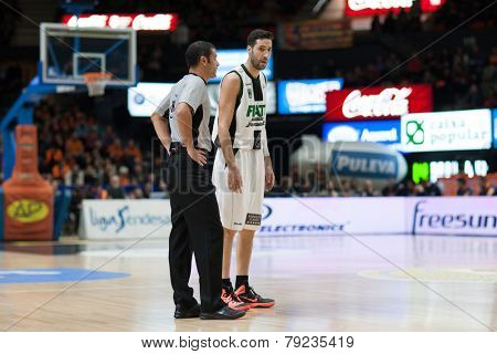 VALENCIA, SPAIN - DECEMBER 30: Vidal (R) and referee during Spanish League match between Valencia Basket Club and Juventut at Fonteta Stadium on December 30, 2014 in Valencia, Spain
