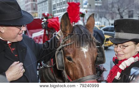 Timothy Cardinal Dolan blesses carriage horse