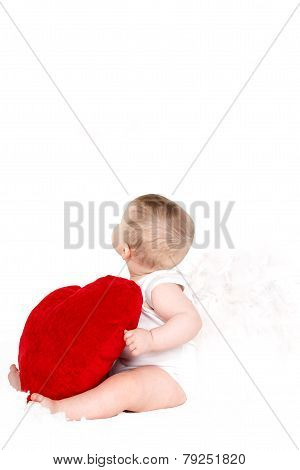 Cute happy valentine angel playing with red heart