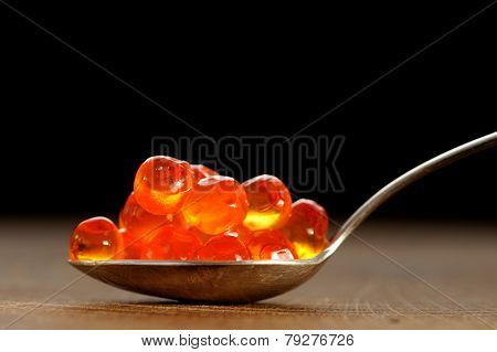 Red Caviar In Silver Spoon Close Up