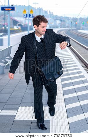 Businessman On Railroad Station In Hastiness