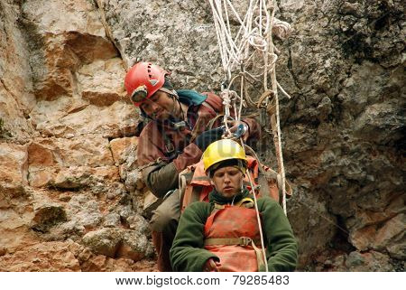 Cavers work out rescue operations in caves.
