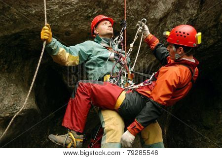 Cavers work out rescue operations in caves.