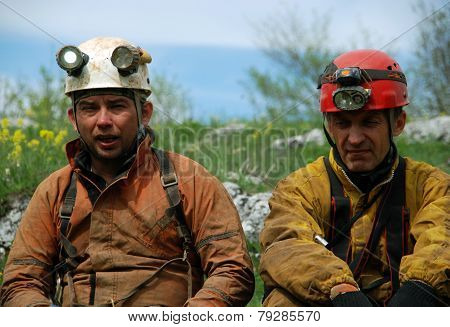 Cavers work out rescue operations in caves.