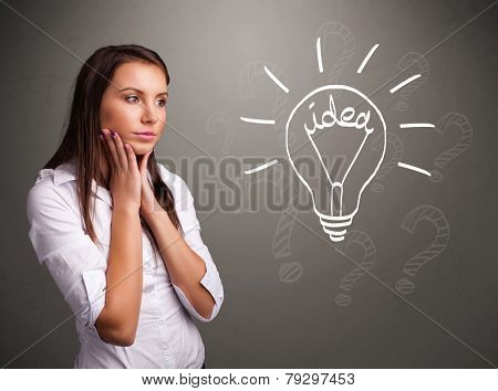 Pretty young girl comming up with a light bubl idea sign