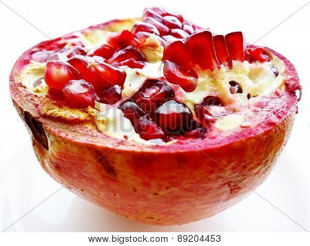 Juicy pomegranate isolated on white background