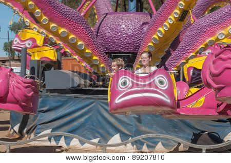 Visitors Enjoying The Amusement Park At The Annual Bloem Show