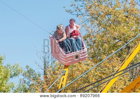 Visitors Enjoying The Amusement Park At The Annual Bloem Show