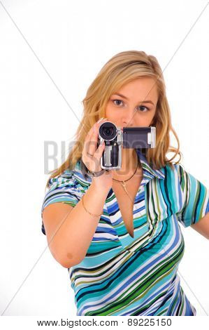 Studio shot of young blone woman with digital camcorder