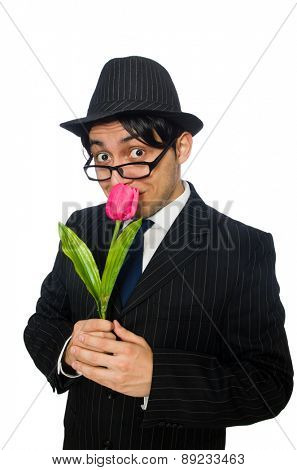 Young man in black costume with flower isolated on white