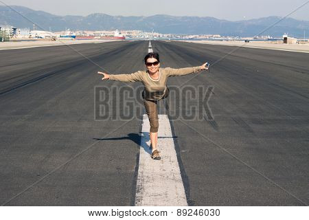 Happy Woman Imitating Airplane