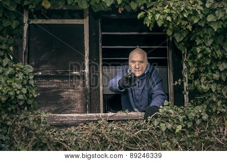 Masked Senior Man Aiming A Gun