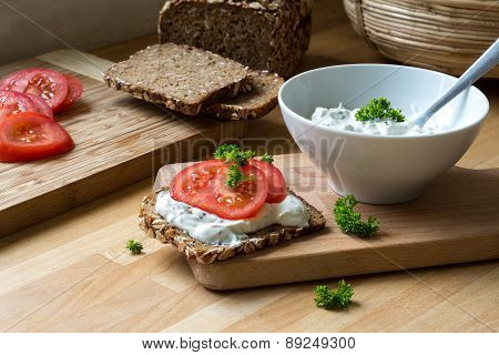 Curd Cheese Dip With Herbs And Rustic Wholegrain Bread With Tomatoes