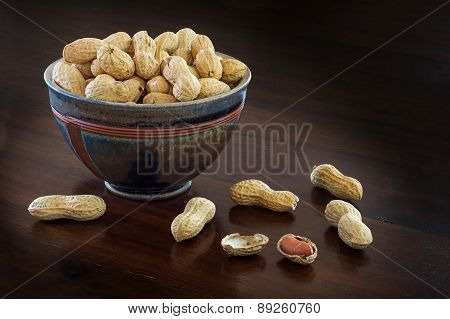 Peanuts In A Ceramic Bowl On A Dark Brown Table, Copyspace