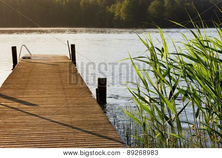 Lake and pier at summer morning