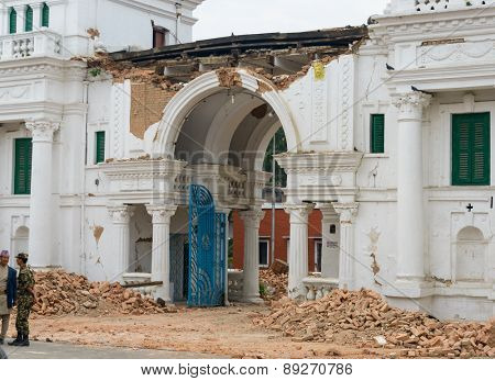 KATHMANDU, NEPAL - APRIL 26, 2015: Narayanhiti palace (the royal palace residence) entrance is damaged after a 7.8 earthquake hit Nepal on 25 April 2015.