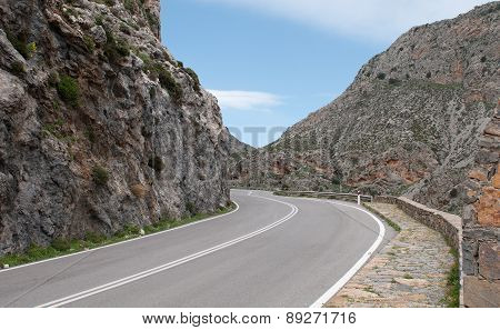 Empty Rural Road Passing Via A Beautiful  Gorge