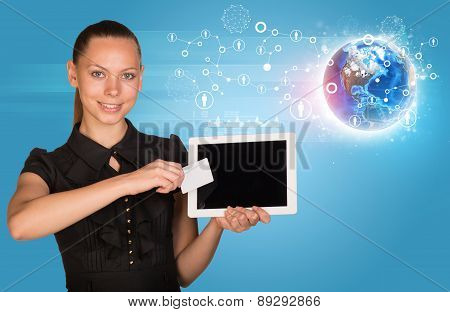 Young woman in black dress holging tablet and card