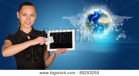 Businesswoman in black dress with Earth model