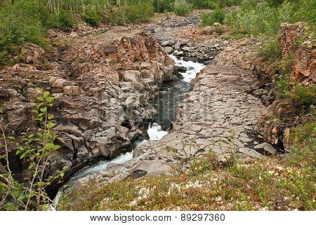 Waterfall In The Rocks