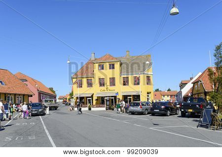 SVANEKE - AUGUST 14: Tourists enjoy the sunny weather and walking through the old town on 14 August 2015 in Svaneke on Bornholm Island, Denmark.