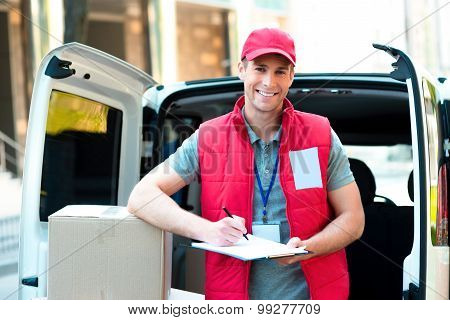 Courier Delivering Package By Van