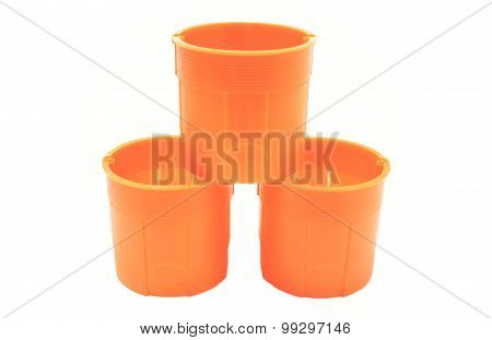 Stack Of Orange Electrical Boxes On White Background
