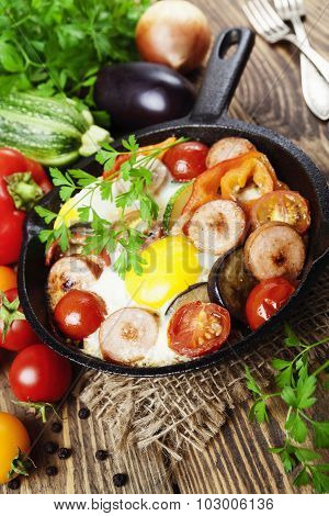 Fried Eggs With Vegetables And Sausage