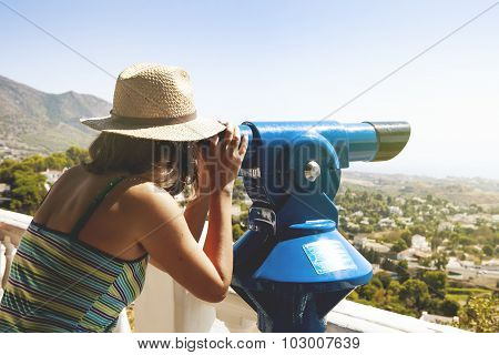 Woman Looking At Landscape Through A Telescope. Vintage Tone.