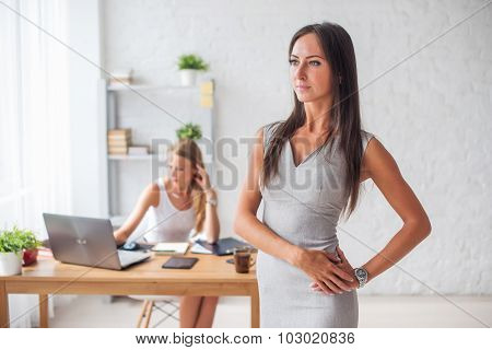 Portait of beautiful successful business woman looking confident and smiling.