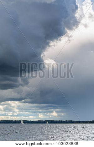 Stormy Lake Landscape With Yachts On Water.