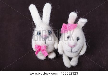 pair of white decorative bunnies