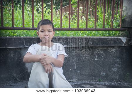 An Asian boy scared and alone