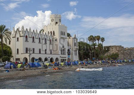 KOS, GREECE - SEP 28, 2015: Tents war refugees in the port of Kos island. Kos island is located just 4 kilometers from the Turkish coast, and many refugees come from Turkey in an inflatable boats.