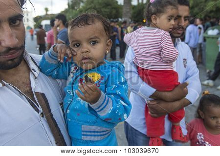 KOS, GREECE - SEP 28, 2015: Unidentified children war refugees. Kos island is located just 4 kilometers from the Turkish coast, and many refugees come from Turkey in an inflatable boats.