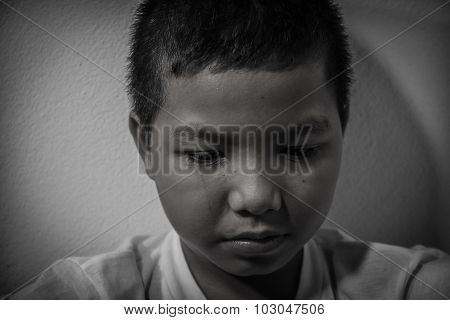 Asian child scared and alone