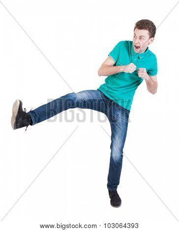 skinny guy funny fights waving his arms and legs. Isolated over white background. Funny guy clumsily boxing. The guy shouts waving foot