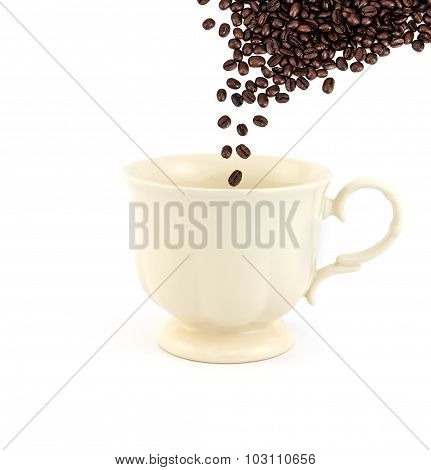 Rosted Coffee Bean Falling Down Into Empty Vintage Tea Or Coffee Cup On White Background