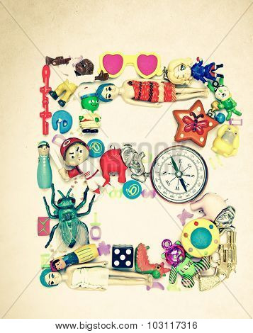 the letter B made from small toys