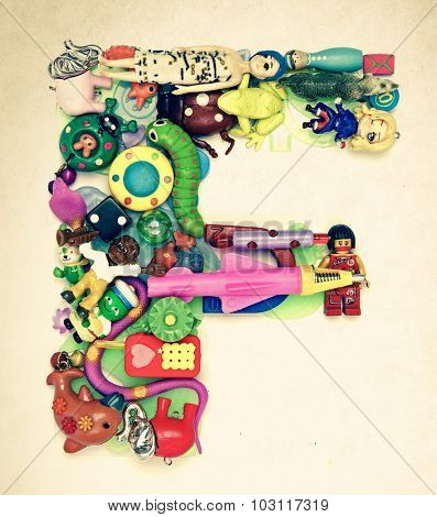 the letter F made from small toys
