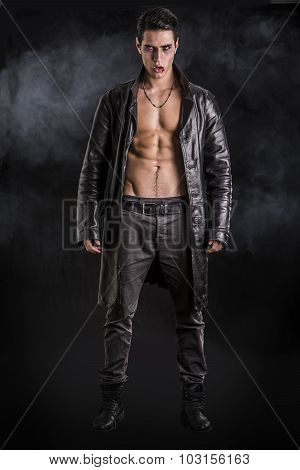 Young Vampire Man in an Open Black Leather Jacket, Showing his Chest and Abs